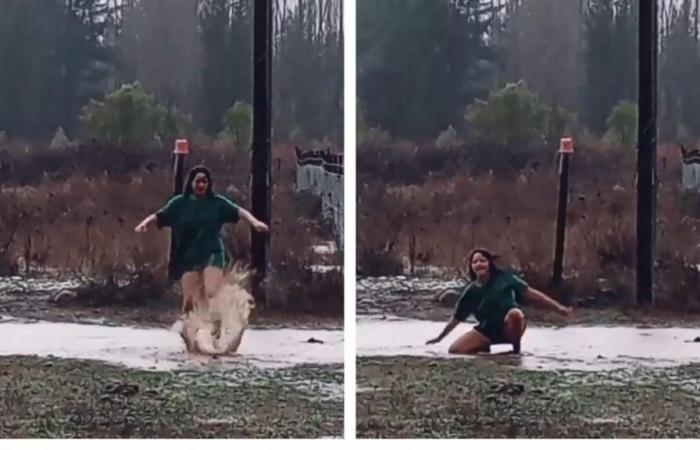 Junger Mann geht mit lustigem Tanz bei starkem Regen mitten im Frontalsystem viral